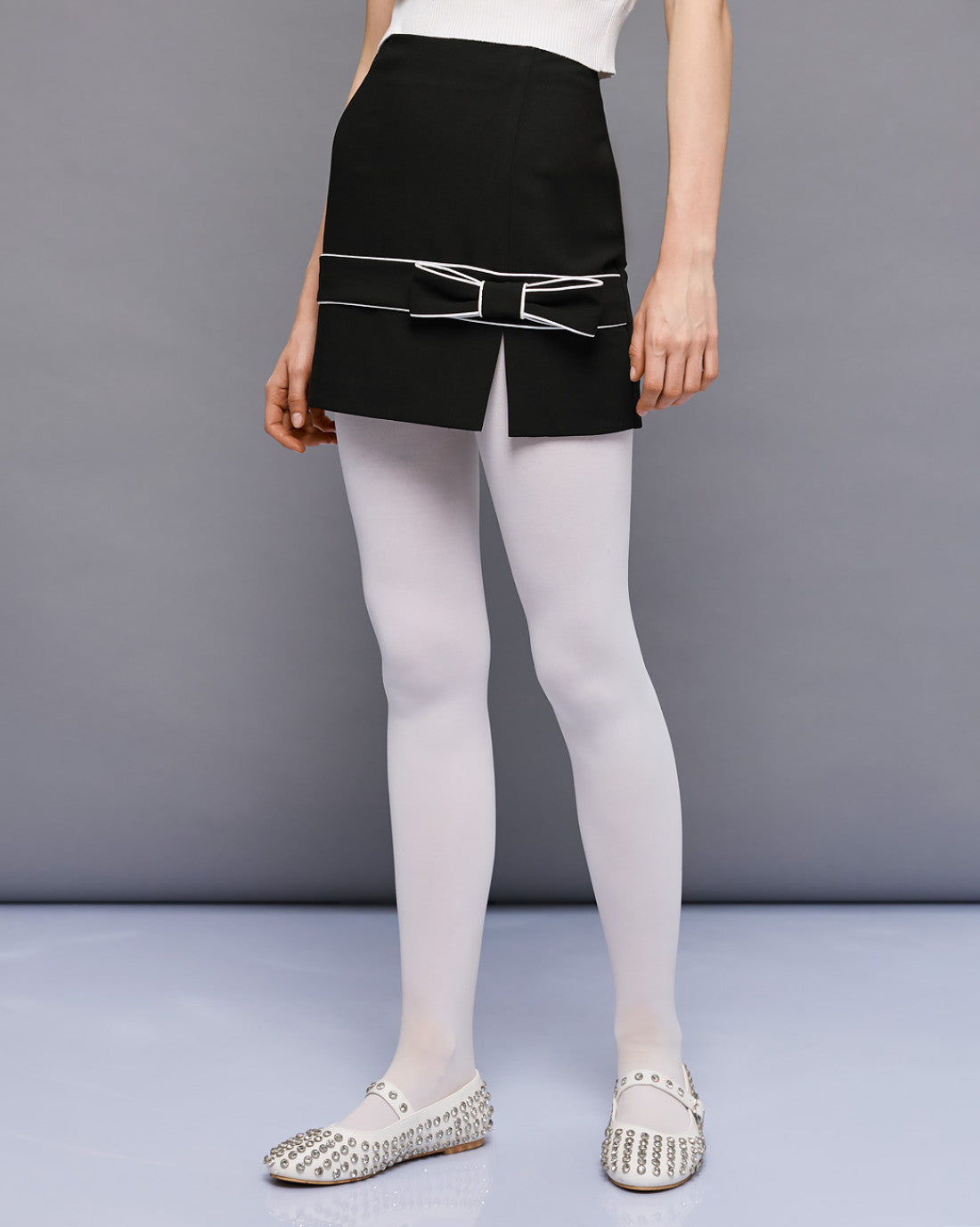 ACCESS Mini skirt with piping and bow