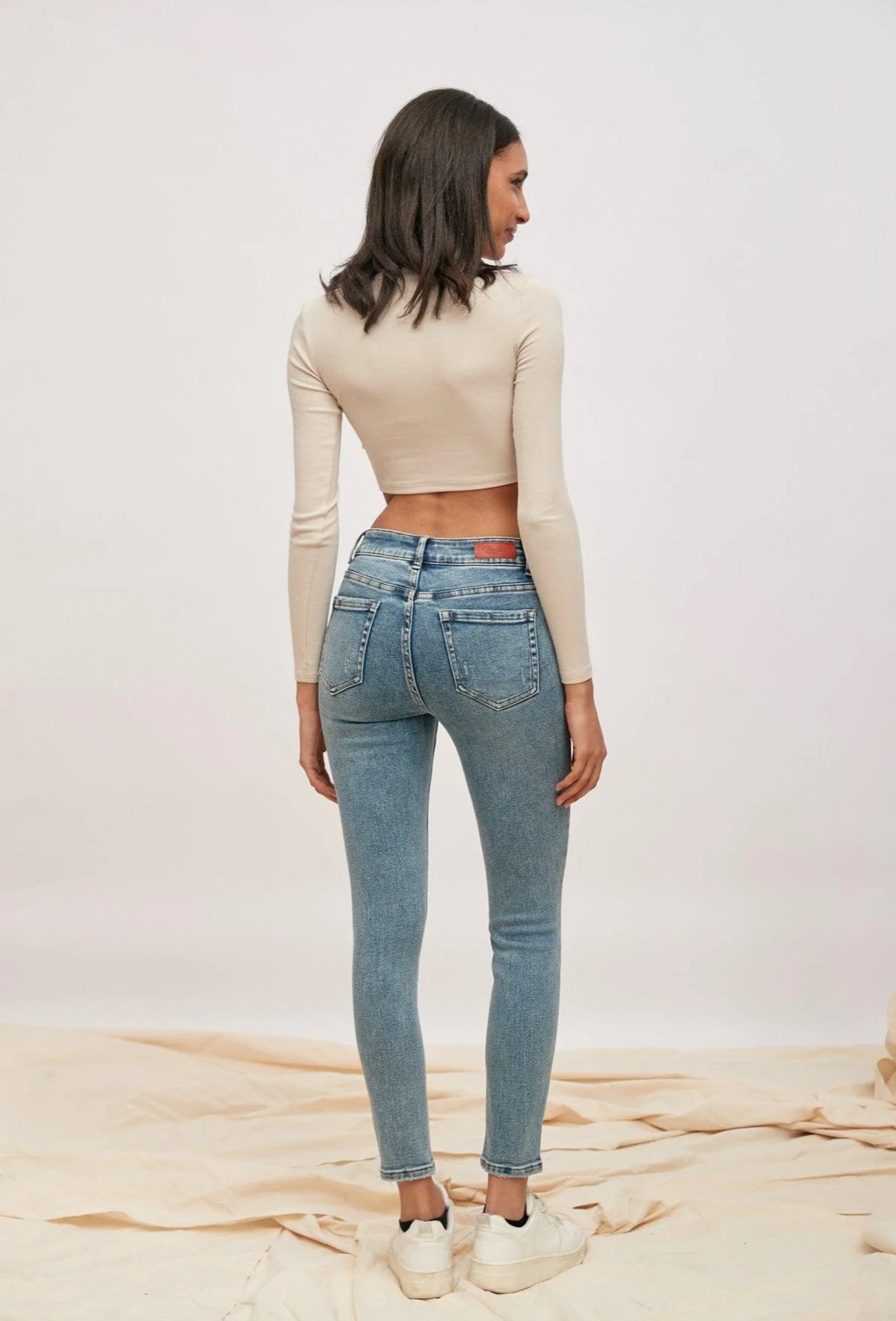 TOXIK Slim fit high waisted distressed jeans.